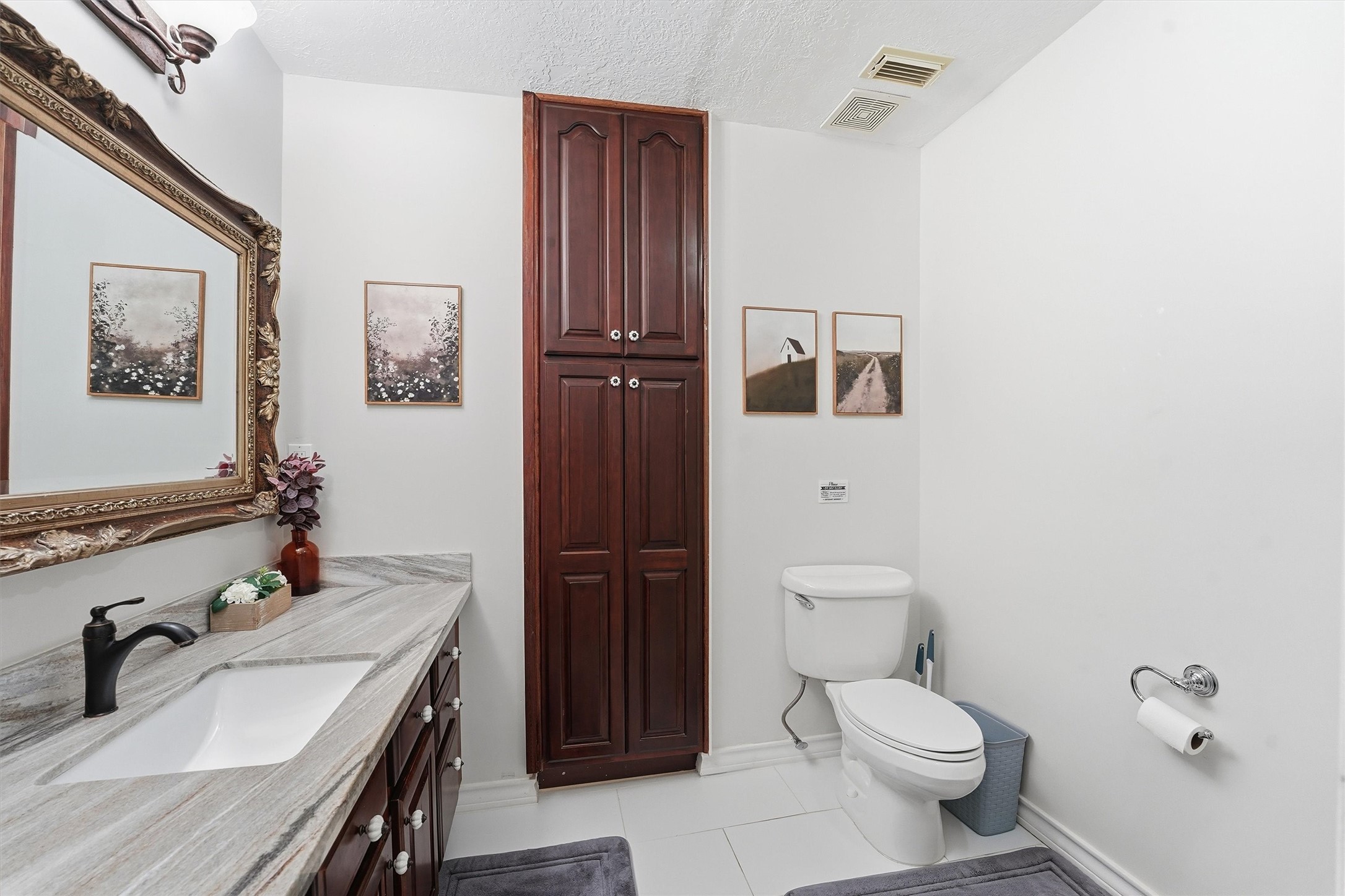 14103 Smith Road Humble, TX 77396 - Photo 17 of 39 a bathroom with a sink a toilet and shower