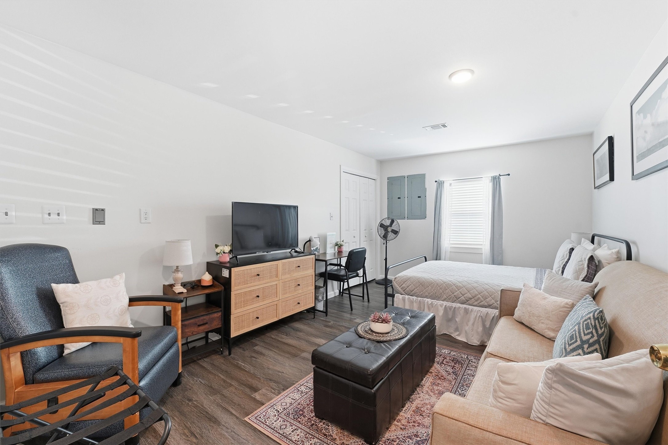14103 Smith Road Humble, TX 77396 - Photo 21 of 39 a living room with furniture and a flat screen tv