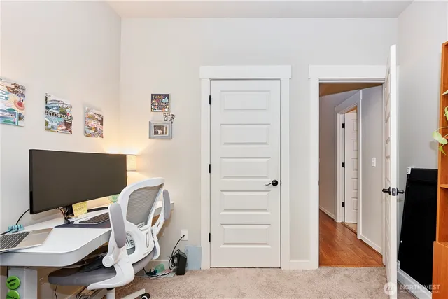 a workspace with furniture and wooden floor