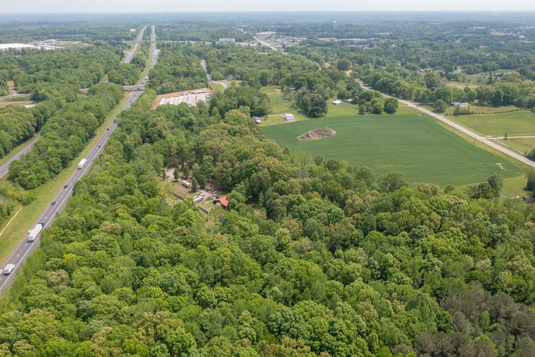 2126 Old Chambliss Road Pleasant View, TN 37146 - Photo 8 of 15 an aerial view of residential houses with outdoor space and trees
