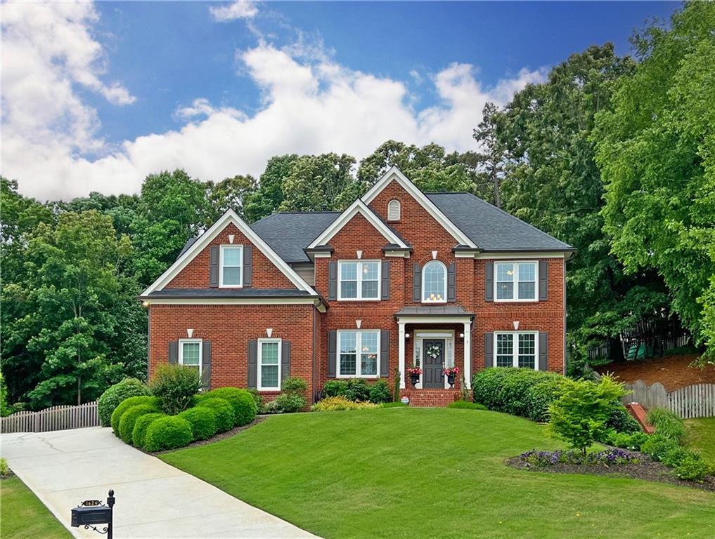 a front view of a house with a yard