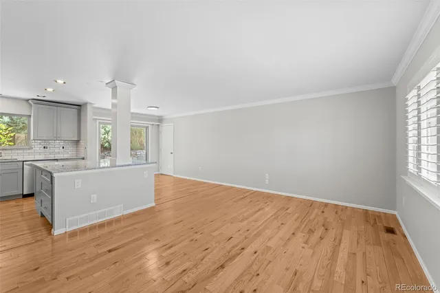 a view of kitchen and wooden floor
