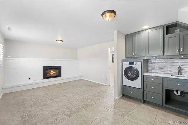 a view of a storage and utility room with a stove top oven