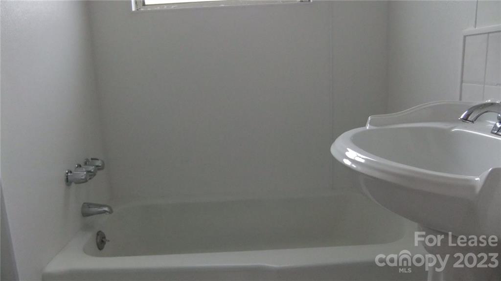 1629 Harris Road Fort Mill, SC 29708 - Photo 7 of 7 a white bath tub sitting next to a white sink