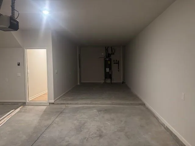 an empty room with closet and windows