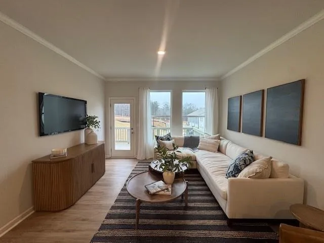 a living room with furniture and a flat screen tv