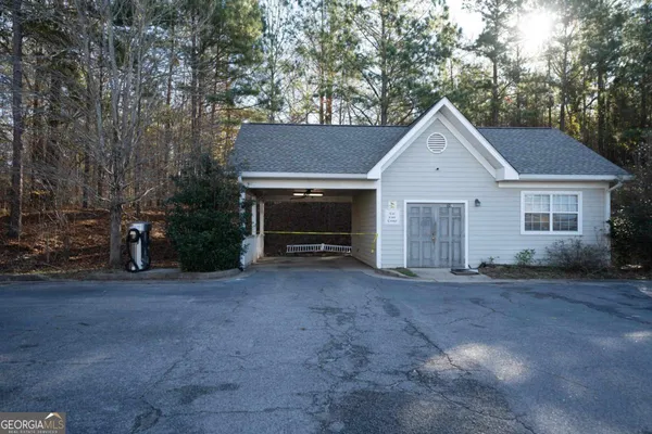 a view of a house with a yard and garage