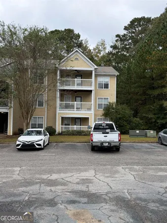 a view of a car parked in front of a house