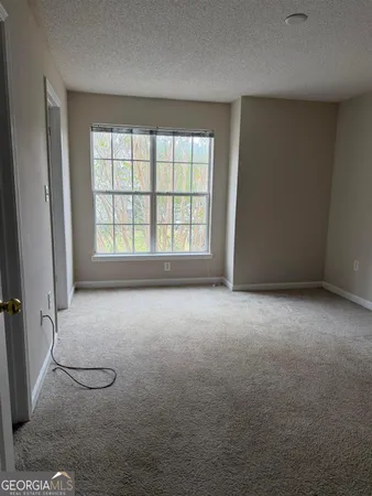 an empty room with a fireplace