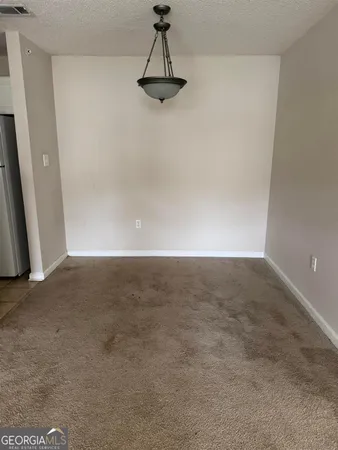 a view of a refrigerator in a room