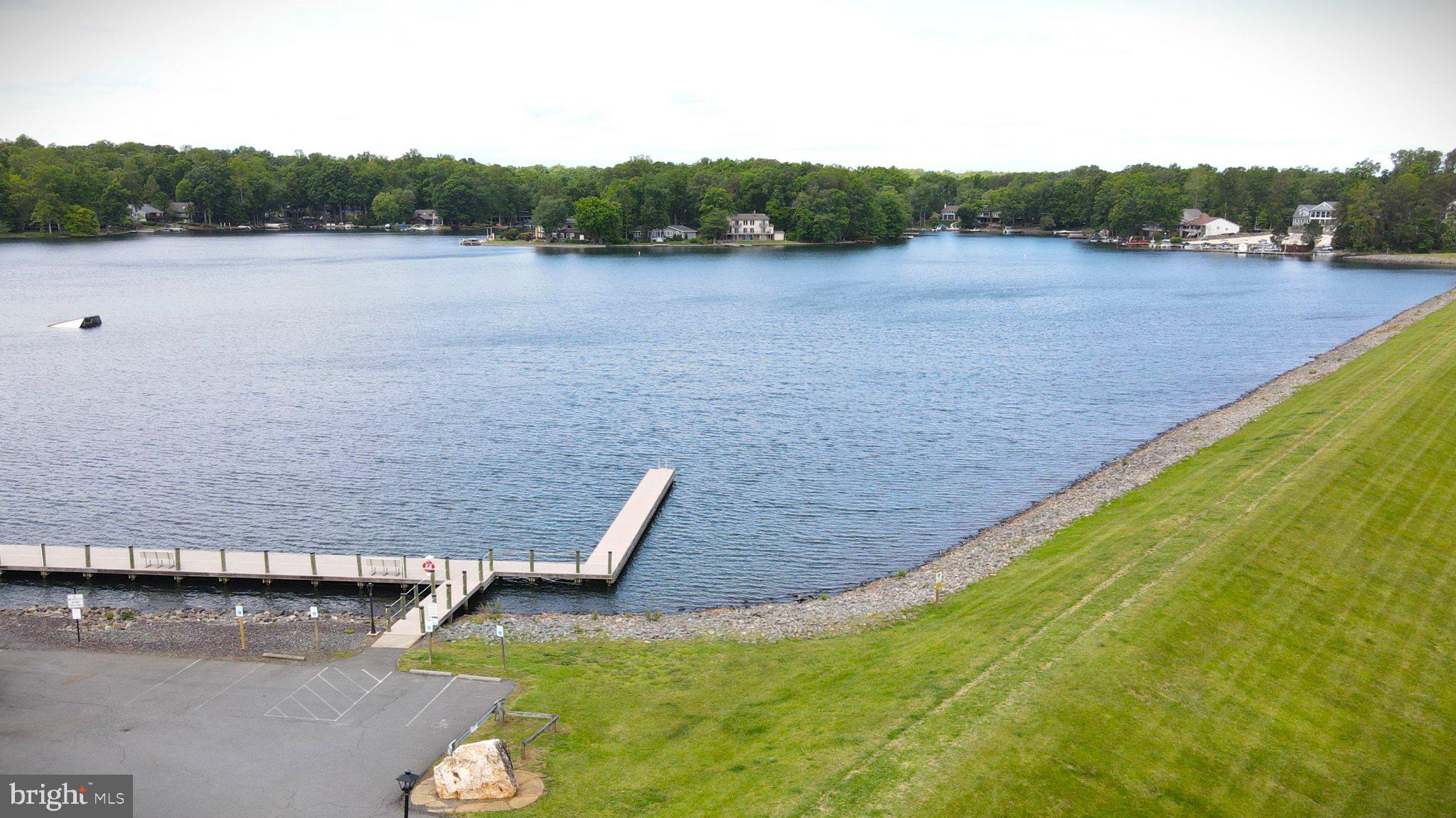216 Spotswood Road Locust Grove, VA 22508 - Photo 64 of 65 Serene lakeside view with lush greenery.