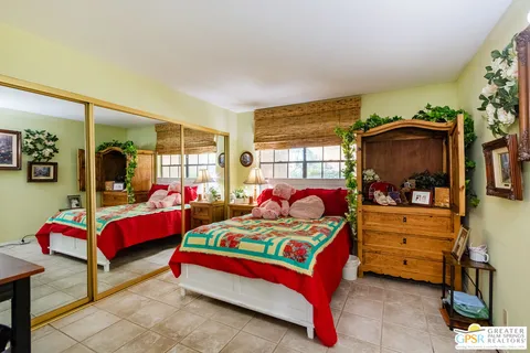 a bedroom with bed and window