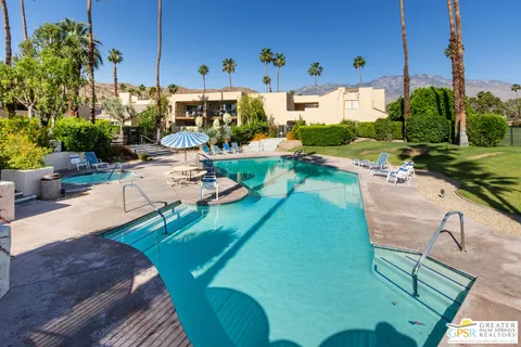 a view of a swimming pool with a patio