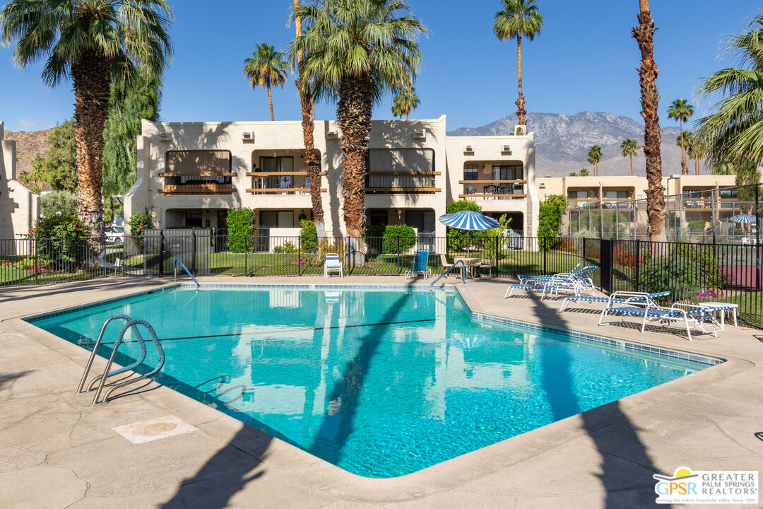 5300 East Waverly Drive, Unit C13 Palm Springs, CA 92264 - Photo 27 of 32 a view of a swimming pool with outdoor seating