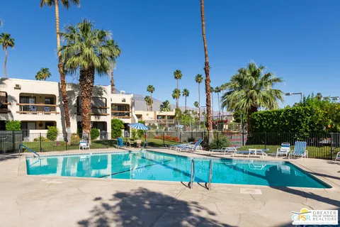 a view of a swimming pool with a patio