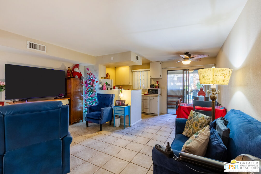 5300 East Waverly Drive, Unit C13 Palm Springs, CA 92264 - Photo 6 of 32 a living room with furniture and a flat screen tv