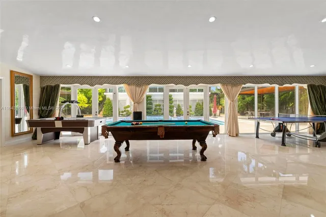 a view of a livingroom with a ceiling fan and window