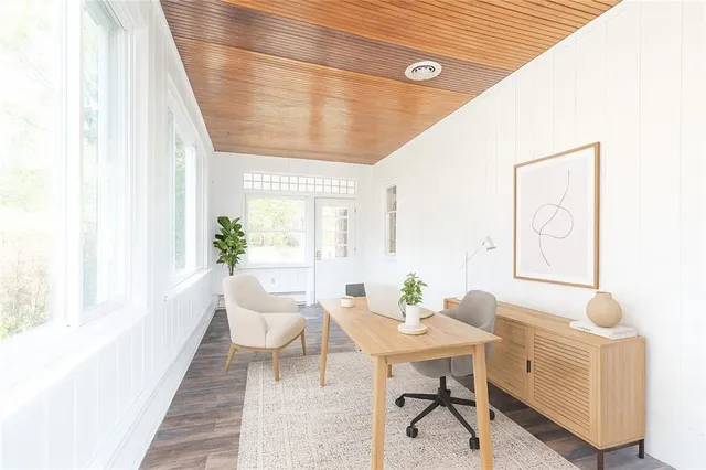 a view of a dining room with furniture and window