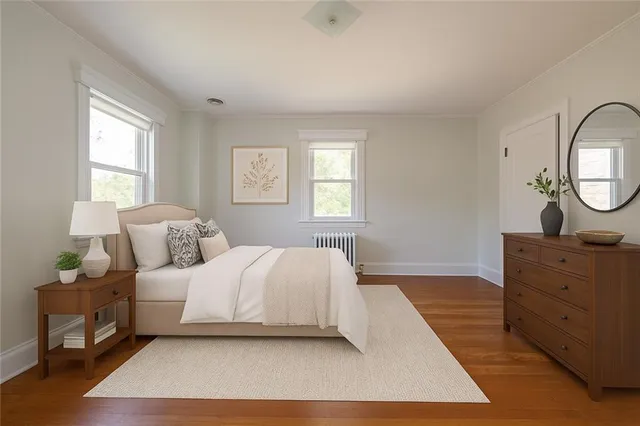 a bedroom with a large bed and window