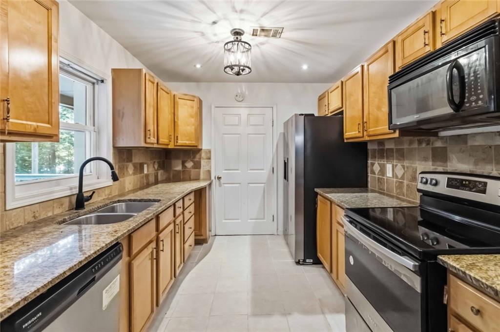 3290 Stonewall Tell Road Atlanta, GA 30349 - Photo 29 of 43 Gallery Image 29