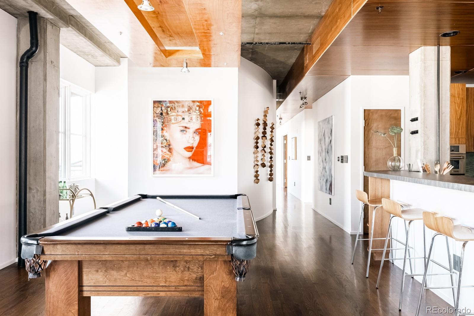 1735 19th Street, Unit 4A Denver, CO 80202 - Photo 12 of 25 a view of a hallway with wooden floor and windows