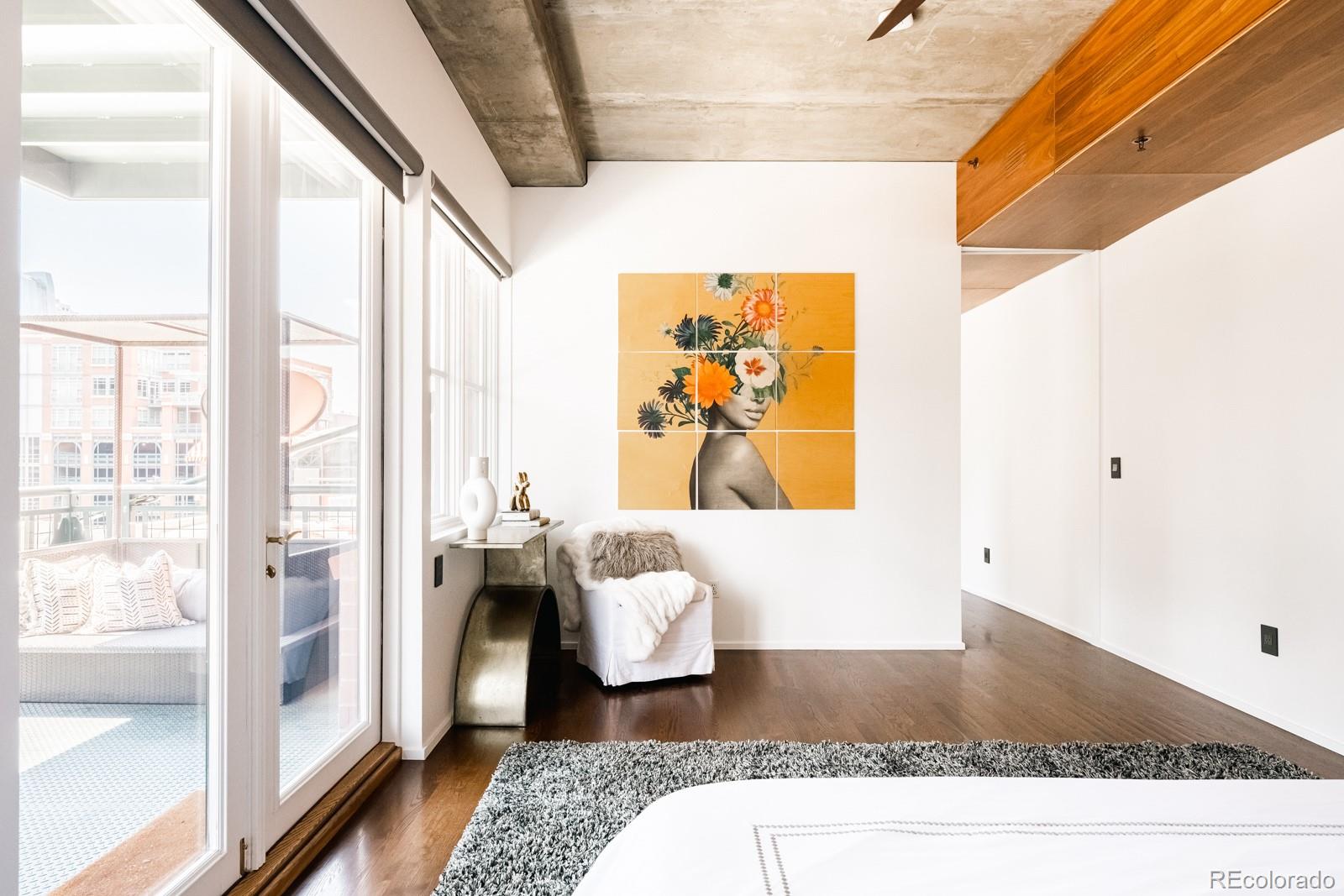 1735 19th Street, Unit 4A Denver, CO 80202 - Photo 19 of 25 a living room with furniture and a window