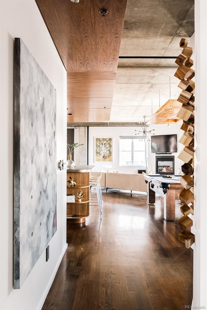 1735 19th Street, Unit 4A Denver, CO 80202 - Photo 8 of 25 a view of a living room with furniture and a window