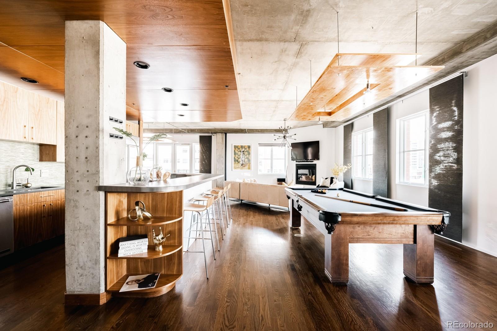 1735 19th Street, Unit 4A Denver, CO 80202 - Photo 9 of 25 a very nice looking living room with wooden floor and furniture