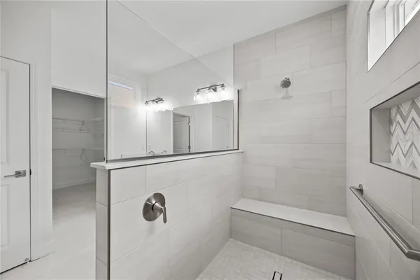 a bathroom with a double vanity sink and a mirror