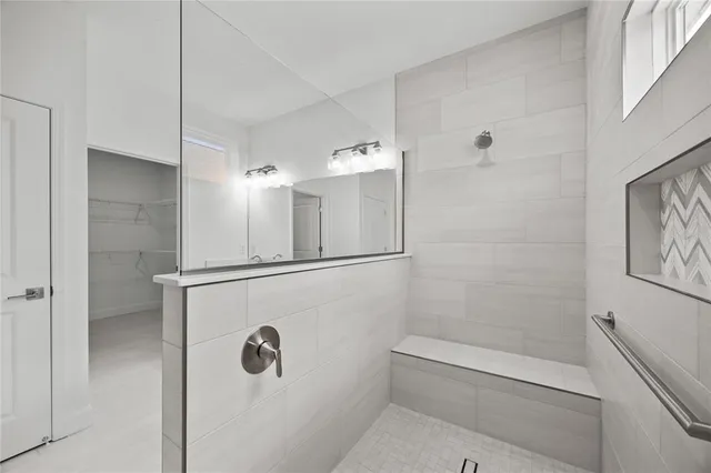 a bathroom with a double vanity sink and a mirror