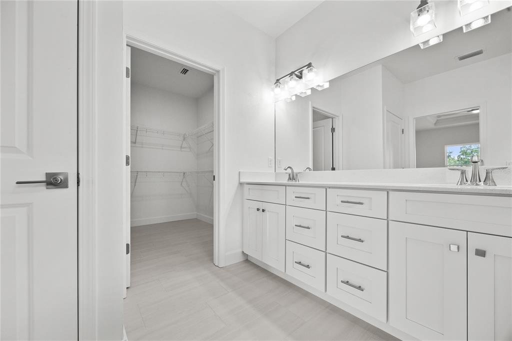 1018 Southwest 67th Drive Gainesville, FL 32607 - Photo 17 of 29 a bathroom with double vanity a and a shower