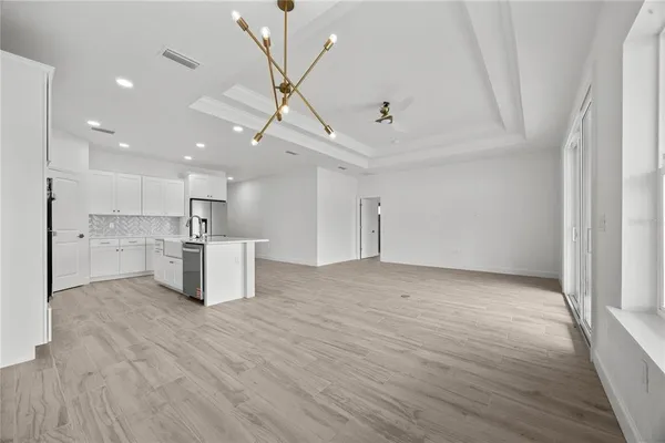 a kitchen with cabinets and window