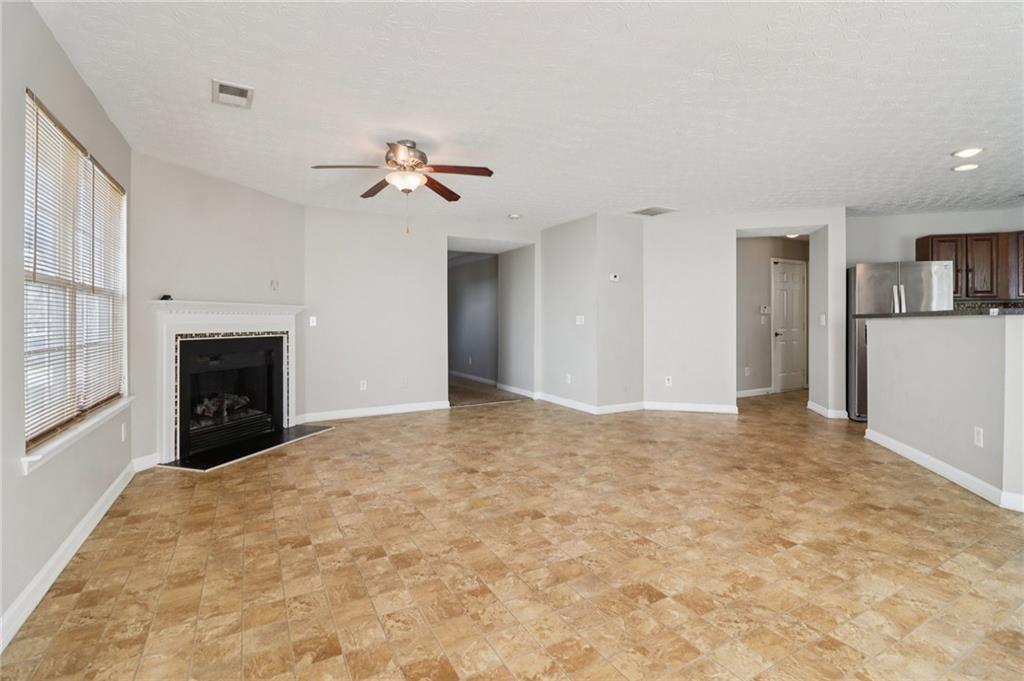 3118 Farmstead Court Grayson, GA 30017 - Photo 16 of 55 a view of empty room with a fireplace
