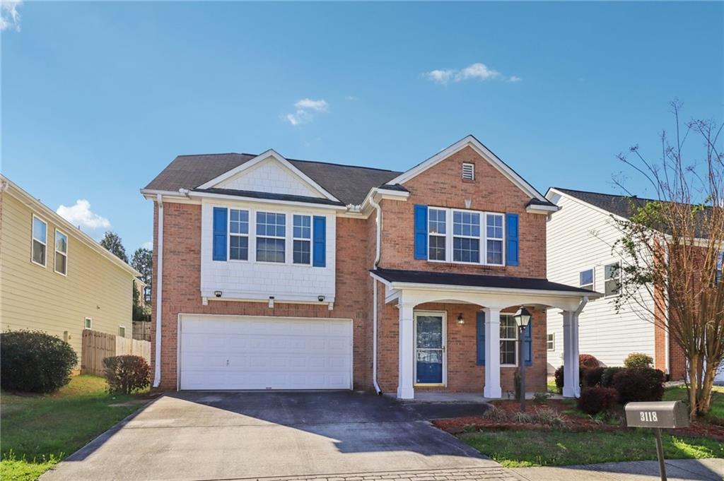 3118 Farmstead Court Grayson, GA 30017 - Photo 2 of 55 a front view of a house with a yard