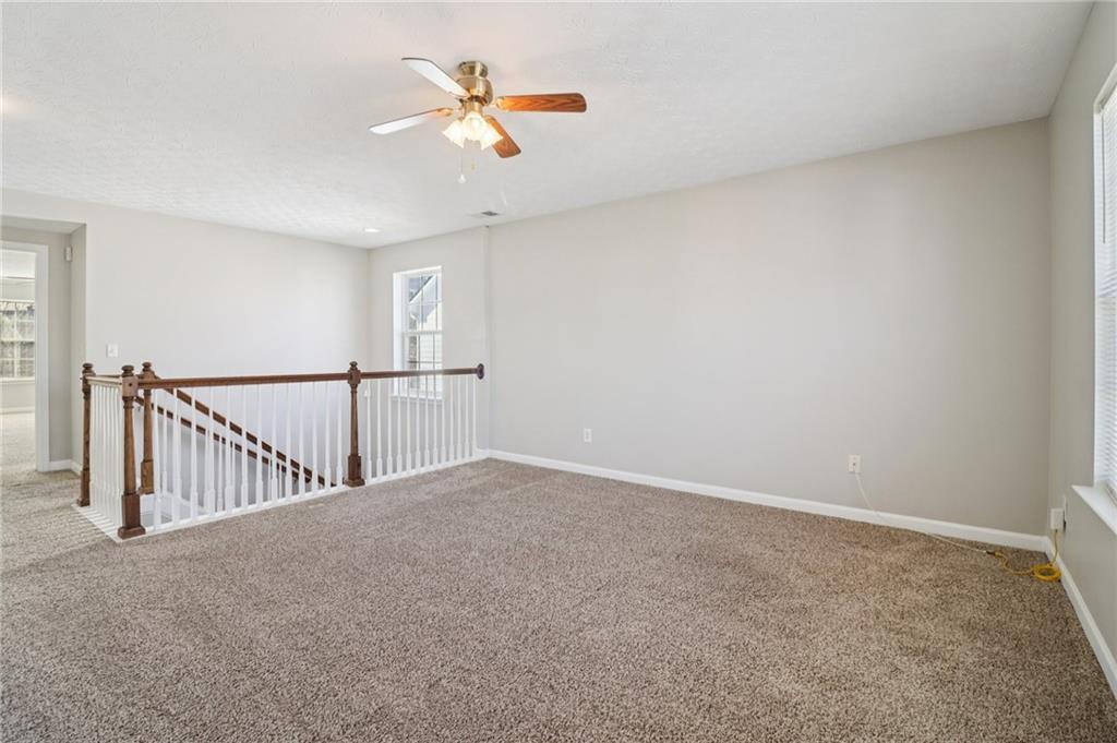 3118 Farmstead Court Grayson, GA 30017 - Photo 24 of 55 a view of a livingroom with a ceiling fan