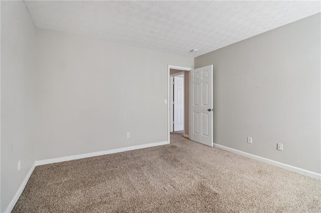 3118 Farmstead Court Grayson, GA 30017 - Photo 35 of 55 a view of an empty room