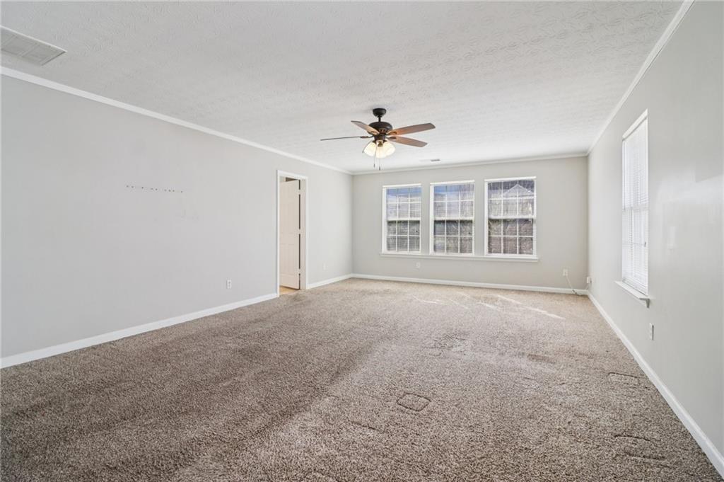 3118 Farmstead Court Grayson, GA 30017 - Photo 38 of 55 an empty room with windows and ceiling fan