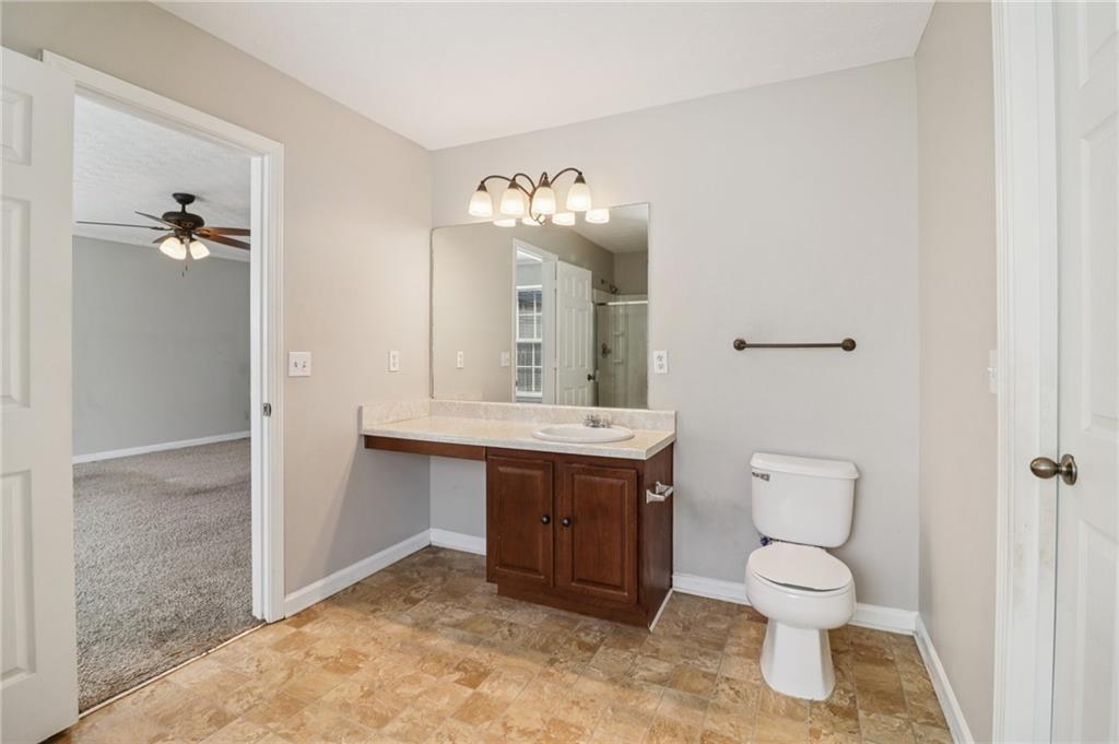 3118 Farmstead Court Grayson, GA 30017 - Photo 49 of 55 a bathroom with a sink and a mirror