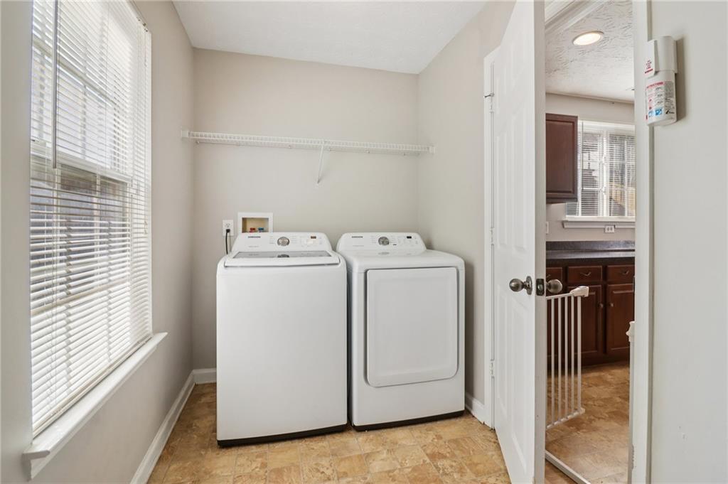 3118 Farmstead Court Grayson, GA 30017 - Photo 50 of 55 a utility room with dryer and washer