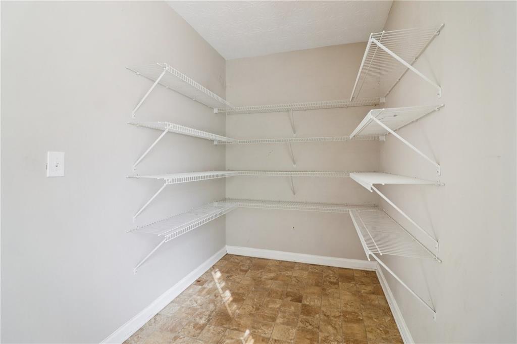 3118 Farmstead Court Grayson, GA 30017 - Photo 51 of 55 a view of a room with shelf on the wall