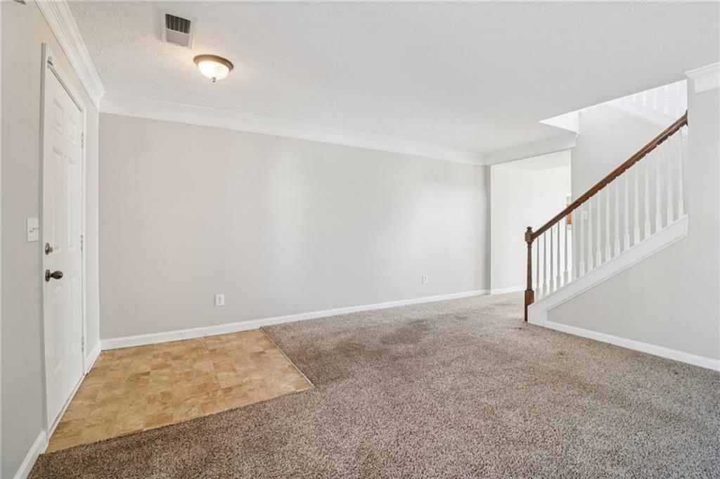 3118 Farmstead Court Grayson, GA 30017 - Photo 8 of 55 a view of an empty room with stairs
