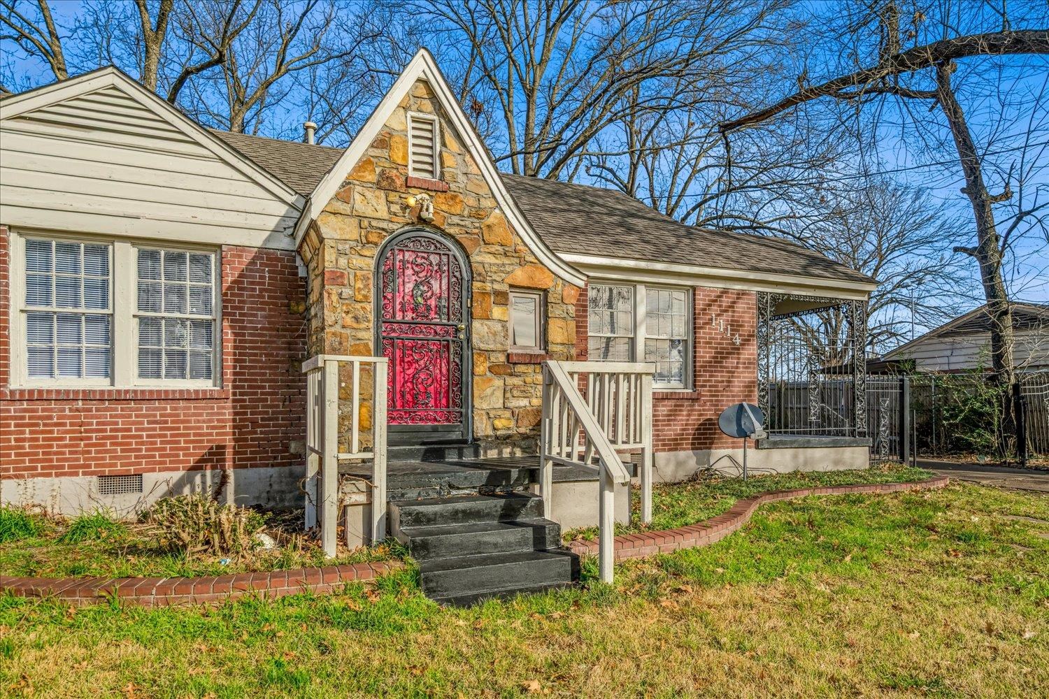 1114 Brownlee Road Memphis, TN 38116 - Photo 3 of 32 Tudor-style house with brick siding, a shingled roof, and crawl space