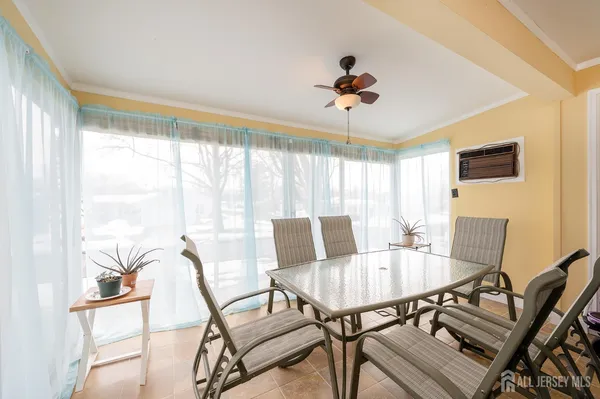 a view of a dining room with furniture window and outside view