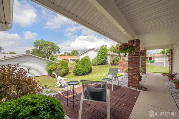 a view of yard with patio