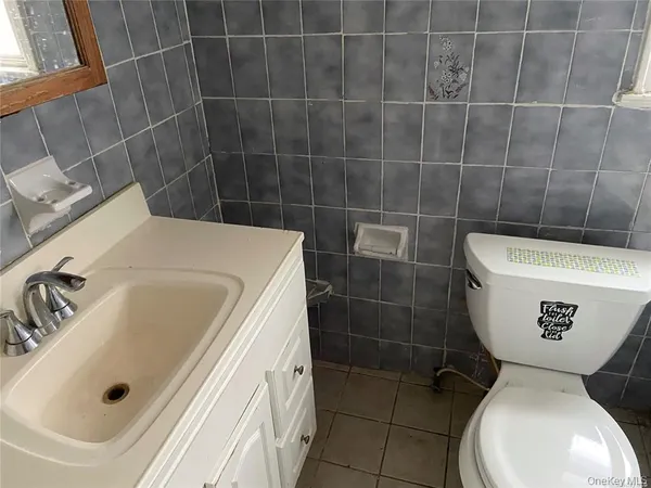 a bathroom with a toilet and a bathtub