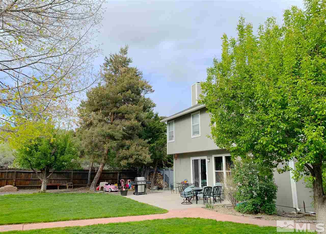 645 Cliff View Drive Reno, NV 89523 - Photo 17 of 19 a front view of a house with a yard and trees