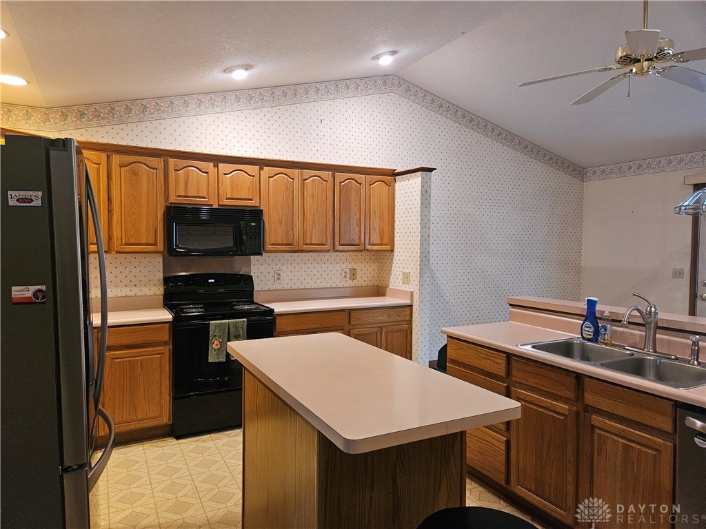 4909 Shannon Avenue Springfield, OH 45504 - Photo 7 of 21 A well-appointed kitchen featuring light-toned cabinetry and practical appliances.