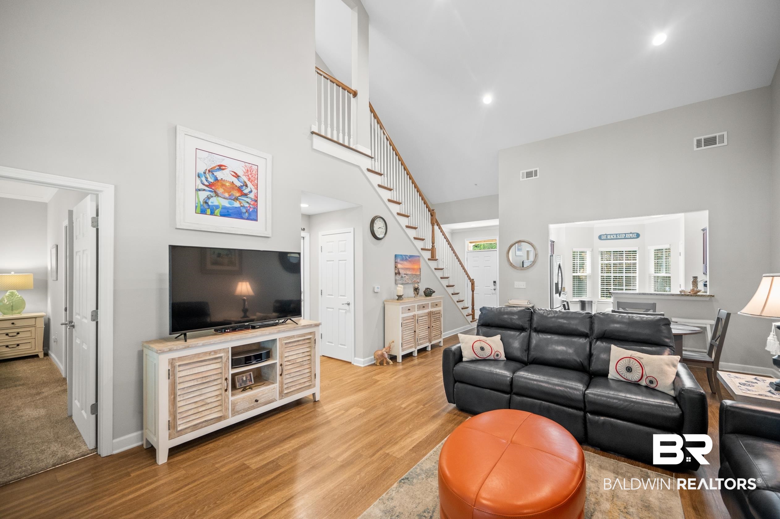 430 West Fort Morgan Road, Unit 1902 Gulf Shores, AL 36542 - Photo 6 of 59 Living room featuring light wood-type flooring and a high ceiling