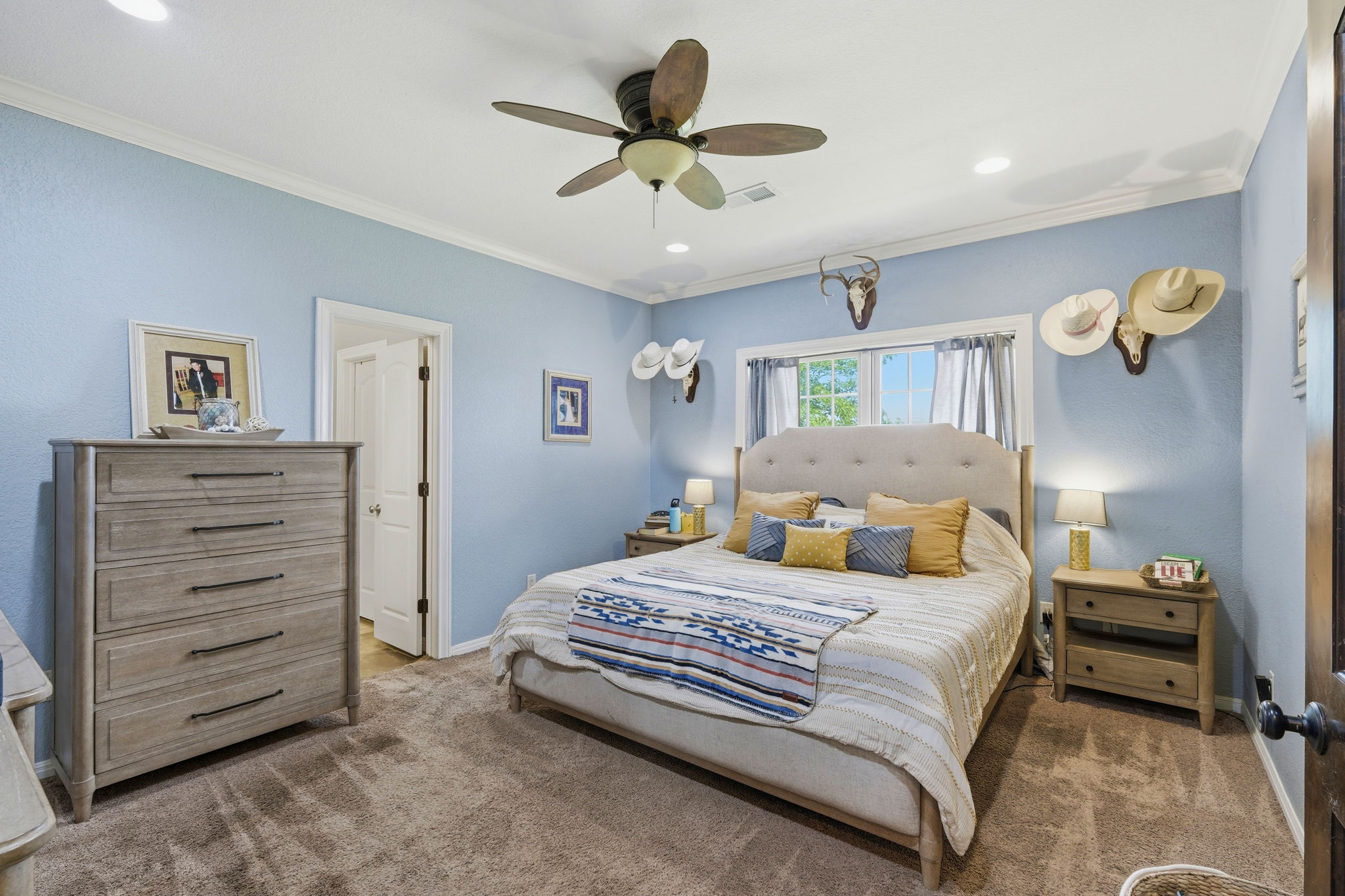 701 County Road 107 Georgetown, TX 78626 - Photo 17 of 30 a bedroom with a bed and ceiling fan