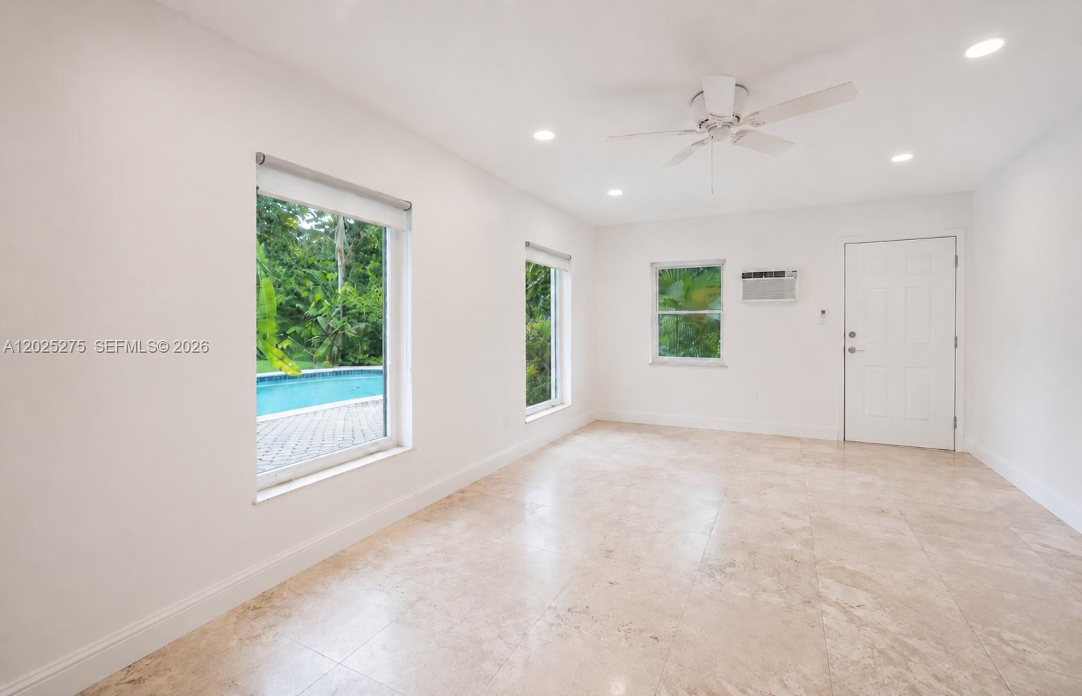 1329 Tyler Street Hollywood, FL 33019 - Photo 10 of 10 an empty room with windows and closet